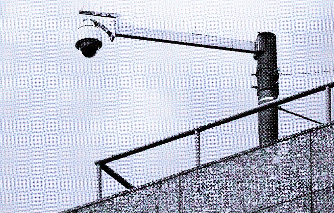 PRODUCTION - 12 June 2023, Baden-Württemberg, Mannheim: A surveillance camera is attached to a build...
