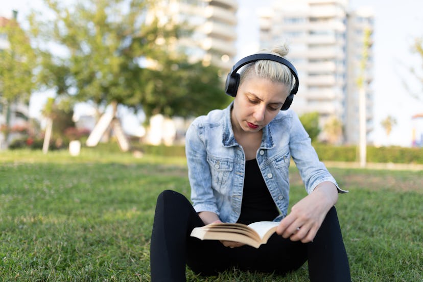Young woman reading in a park