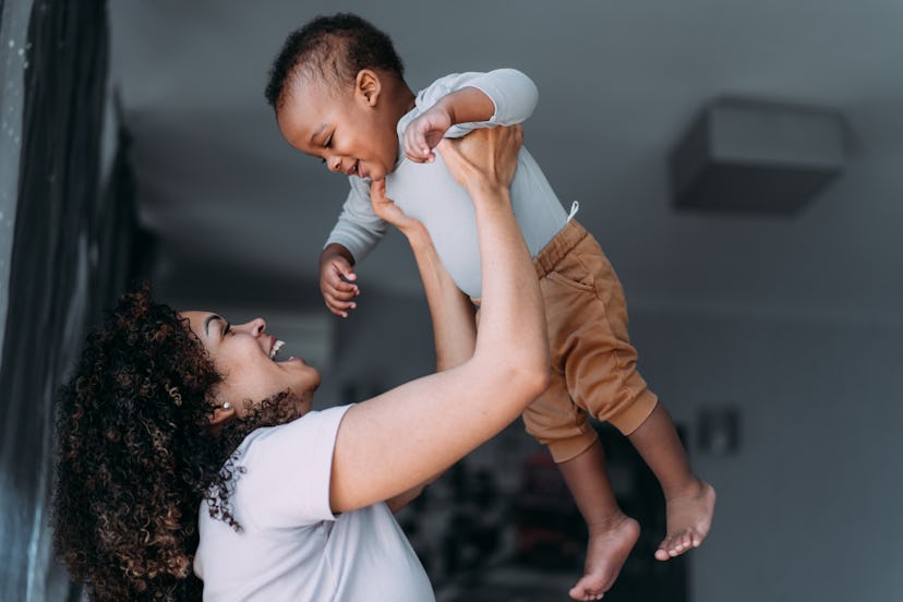 A mom playing with her baby