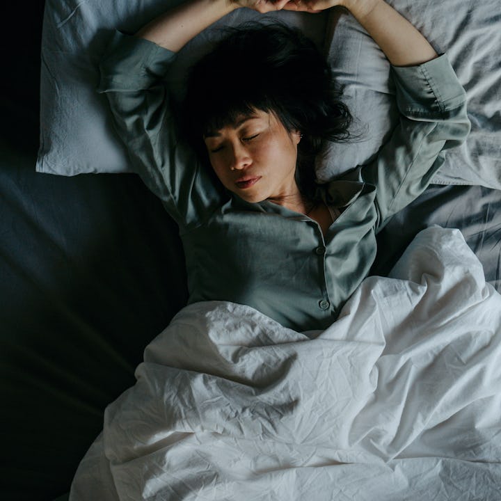 Portrait of a beautiful Japanese woman sleeping in her bed