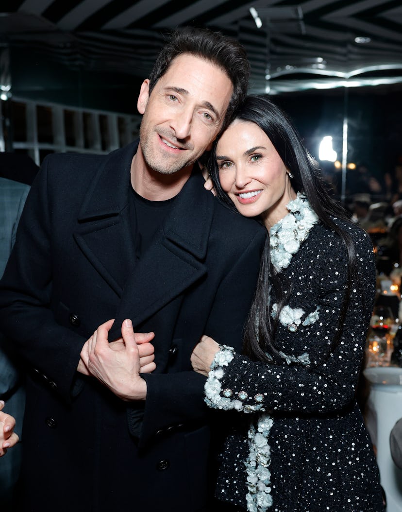 BEVERLY HILLS, CALIFORNIA - MARCH 01: (L-R) Adrien Brody and Demi Moore attend the CHANEL and Charle...