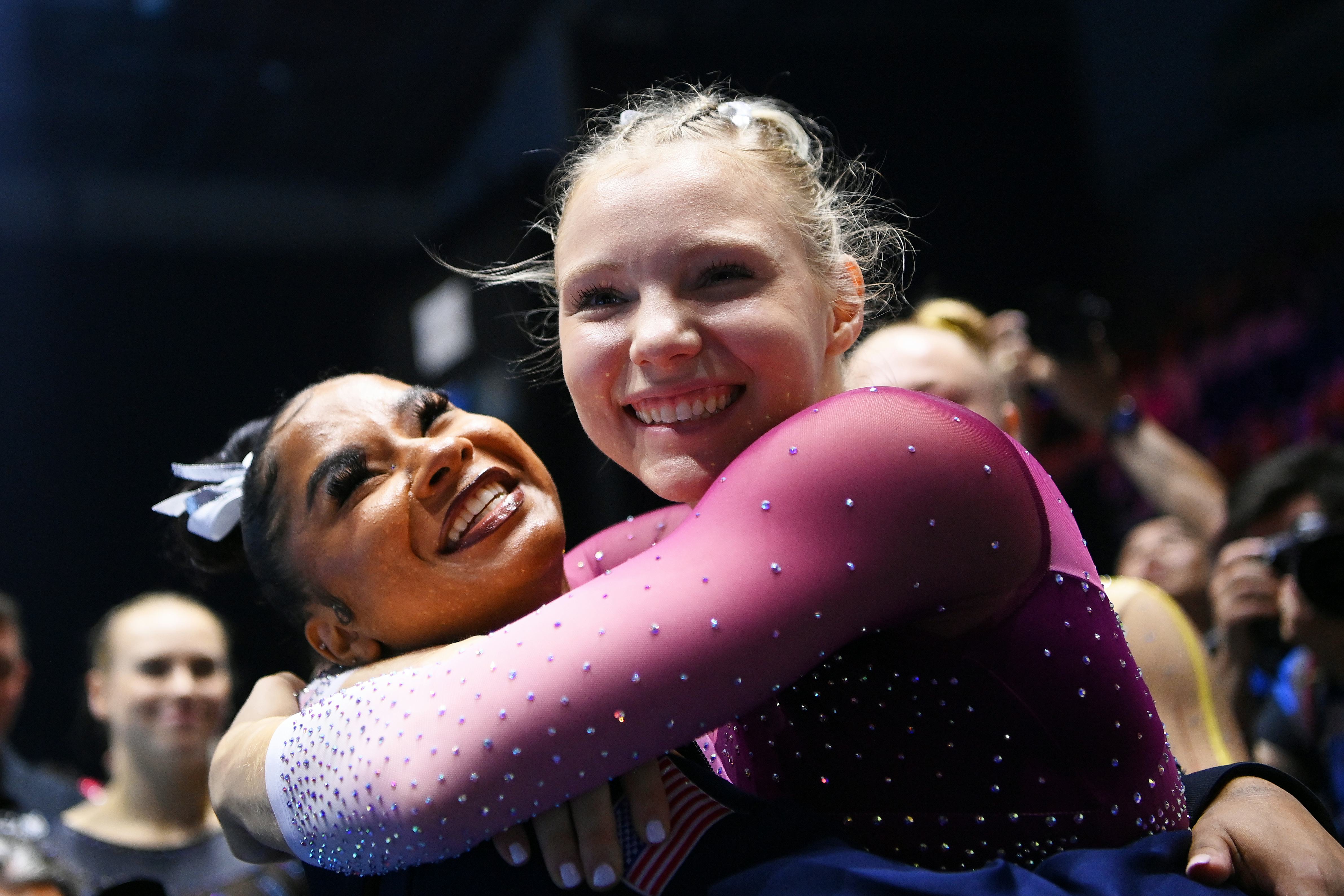 Jade Carey and Jordan Chiles celebrating winning an Olympic gold medal.