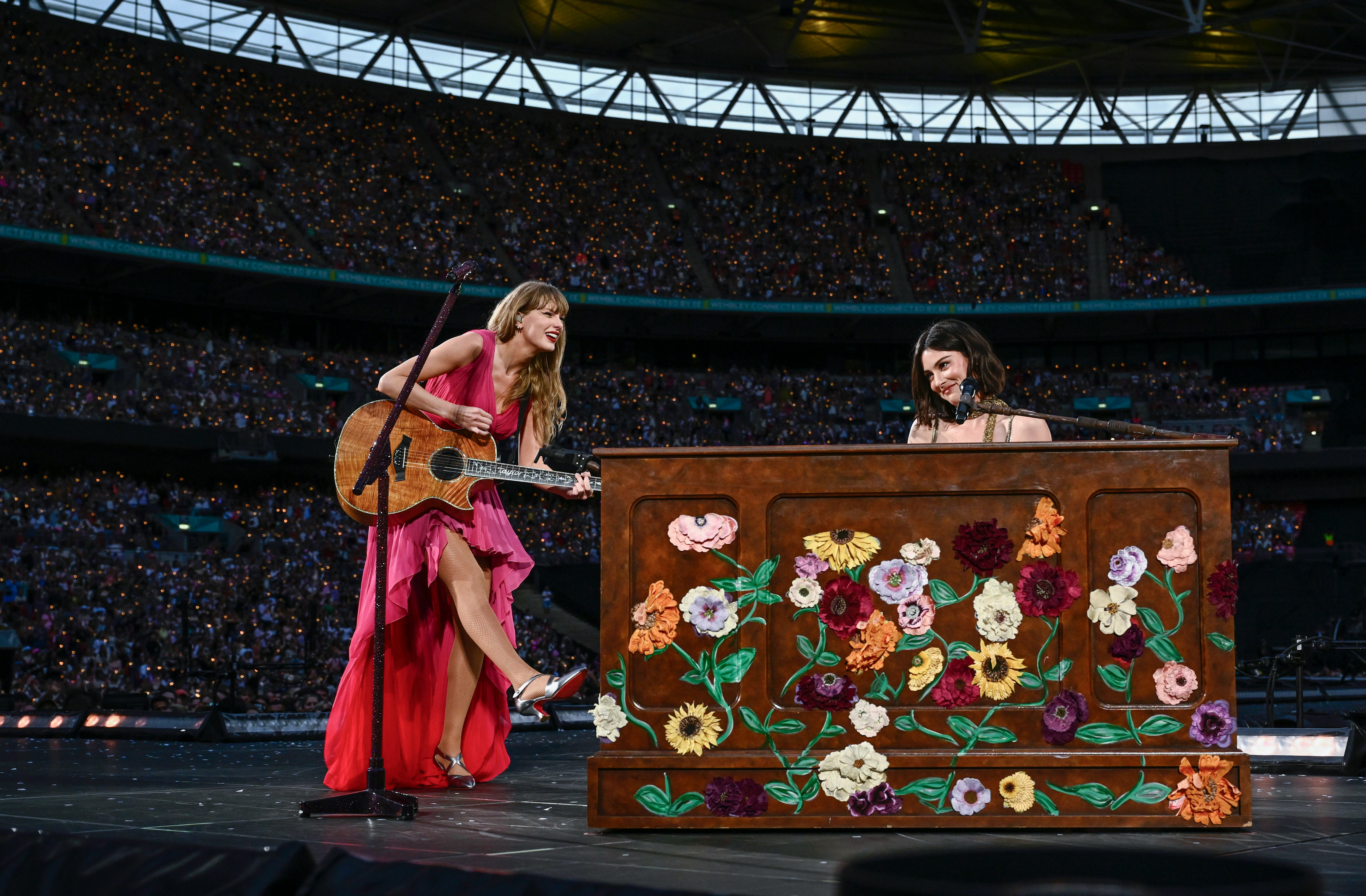 Taylor Swift and Gracie Abrams perform on stage at The Eras Tour