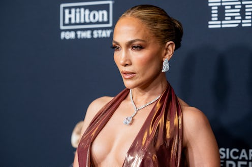 Jennifer Lopez wore a plunging suit to promote her bestie's debut novel.