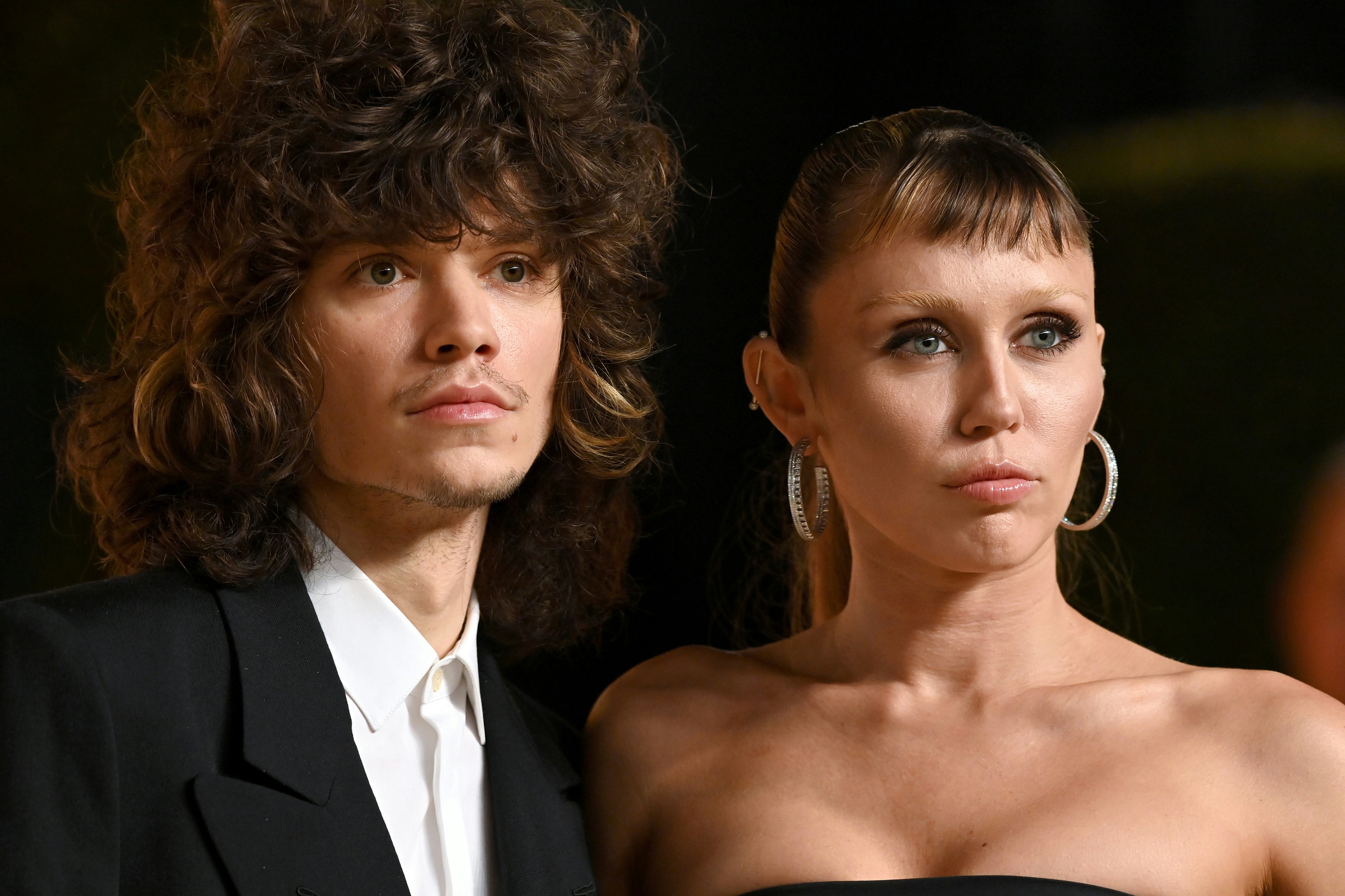 Maxx Morando and Miley Cyrus attend the 2025 Vanity Fair Oscar Party