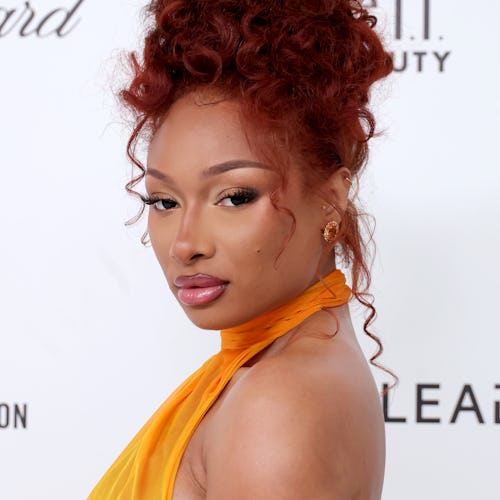 Megan Thee Stallion’s “Megchella” workout ‘fits include plunging, navel-baring tops.