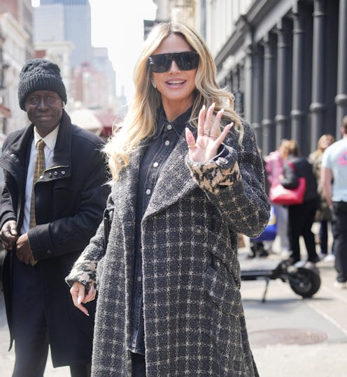 Heidi Klum wore a cleavage-baring jacket and sheer skirt in NYC.