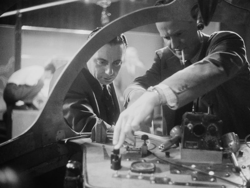American actor Al Hodge (1912 - 1979, right) shows off a special effects unit to British television...