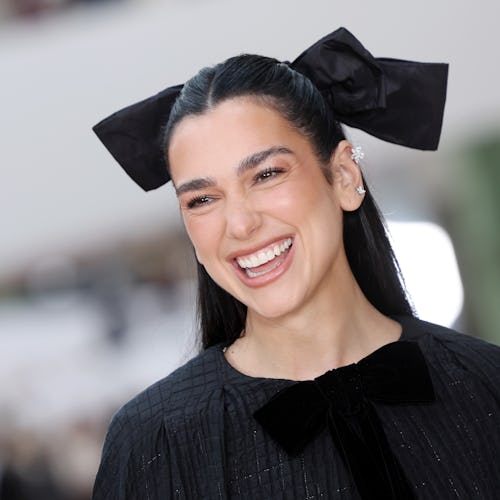 Dua Lipa wore a knit co-ord with short shorts in New Zealand.