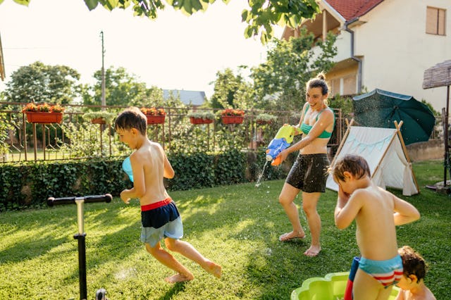 Photo of a happy family spending summer day in their yard