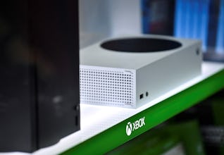 Microsoft’s Xbox Series X (L, in black) and series S (R, in white) gaming consoles are seen on displ…