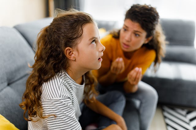 Rude girl ignoring what her single mother is telling her at home.