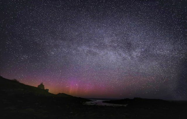 The Northern Lights, the Milky Way and Lyrid meteors falling through the sky at the Bathing House ne...