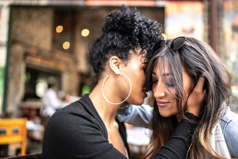 Romantic lesbian couple at restaurant