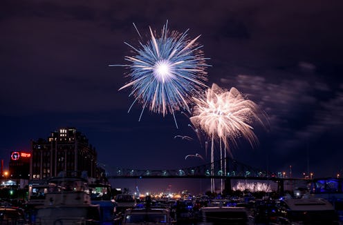Montreal, Canada - July 4, 2024. Firework show over St Lawrence River at night, Montreal, Quebec, Ca...