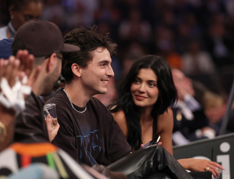 Actor Timothee Chalamet and Kylie Jenner sit court-side during the first quarter in Game Four of the...