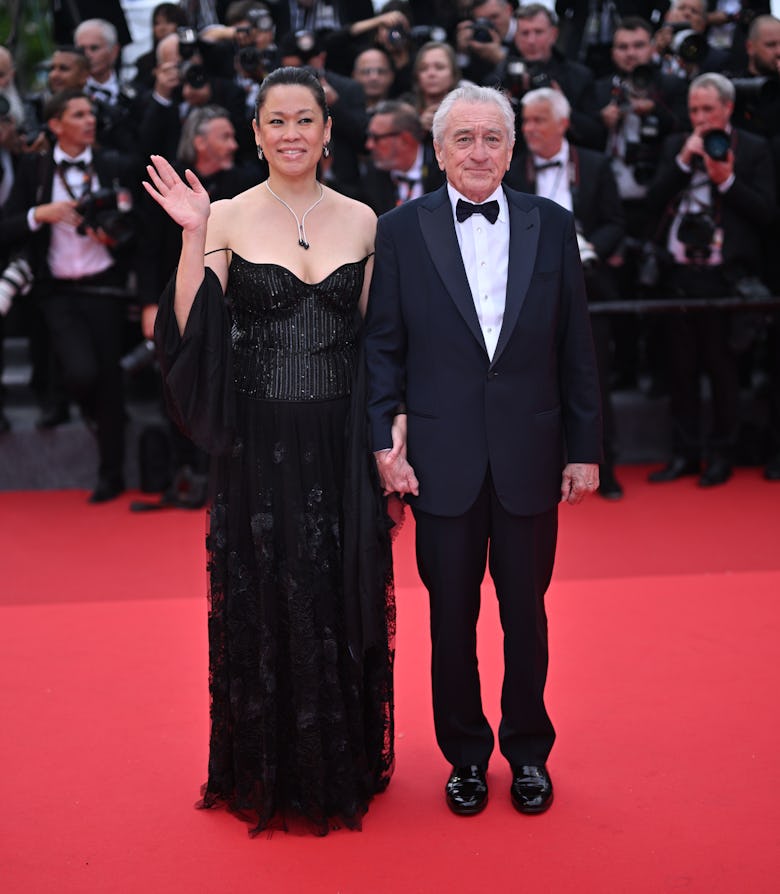 U.S. actor Robert De Niro (R) and his partner Tiffany Chen (L) arrive for the Opening Ceremony and t...