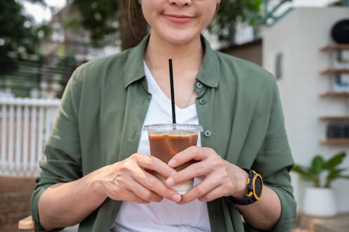 Iced coffee with milk is made using freshly brewed coffee with fat milk, a sweet, simple syrup, and ...