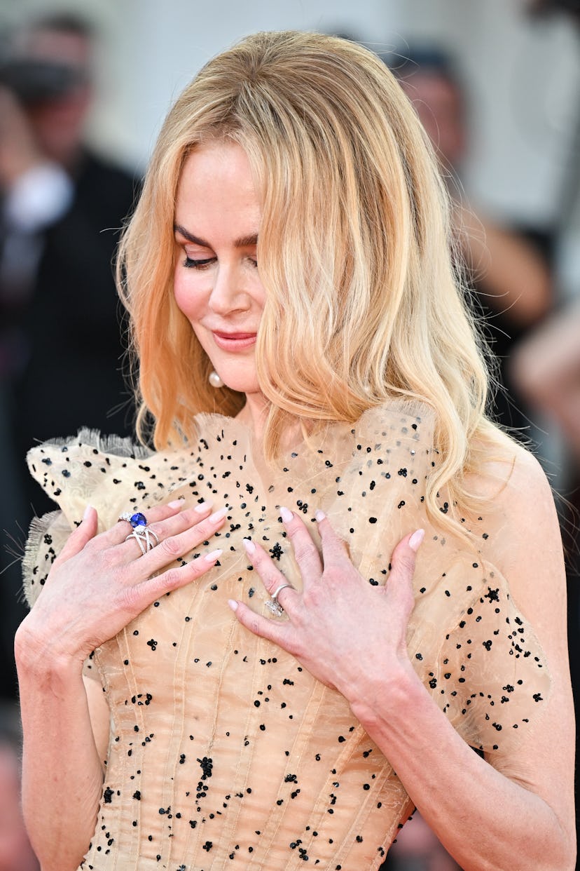 Nicole Kidman’s dolphin-sleek physique, its lone topographical feature the pert, perky bust of an ad...