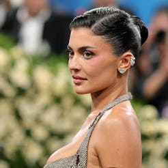 Kylie Jenner shows off major underboob in a cutout swimsuit.