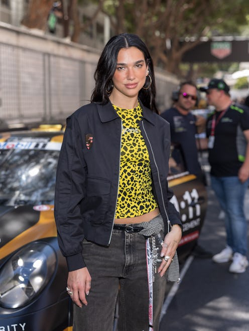 Dua Lipa wore a brown polka dot string bikini on the beach.