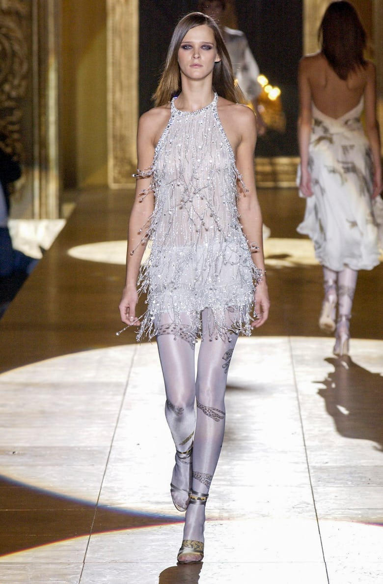 Carmen Kass walks the runway during the Roberto Cavalli Ready to Wear Fall/Winter 2002-2003 fashion ...