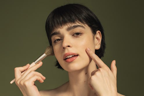 Makeup brush. Beauty portrait. Woman
