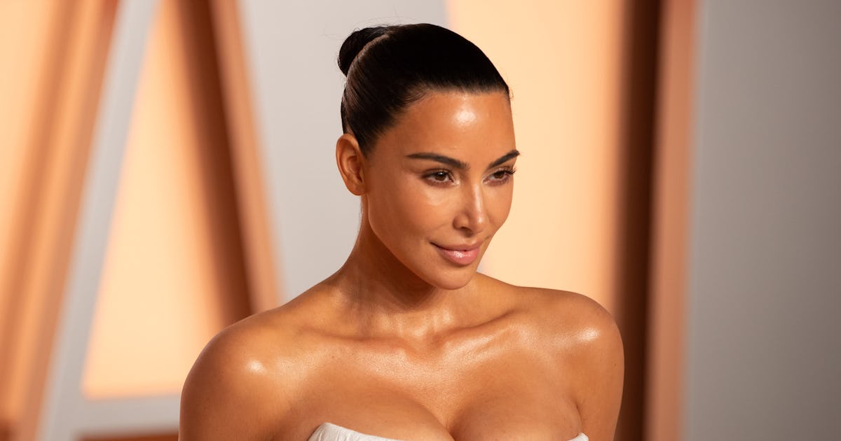 Kim Kardashian Wore A Plunging Bikini Top & A Massive Side-Slit Skirt