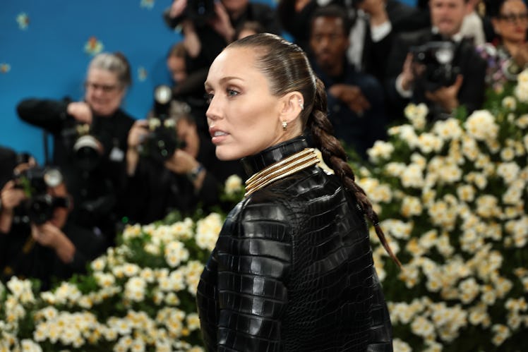 NEW YORK, NEW YORK - MAY 05: Miley Cyrus attends the 2025 Met Gala Celebrating "Superfine: Tailoring...