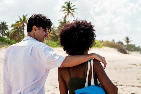 Young couple walking on the beach