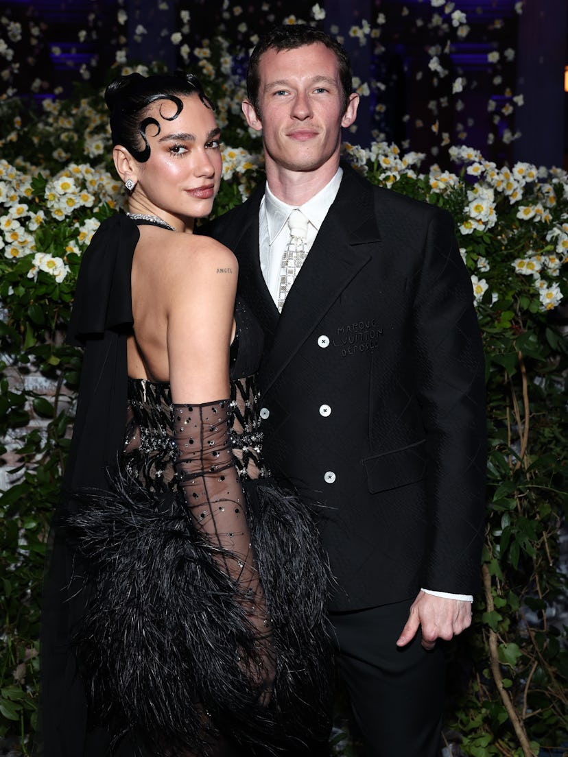 Dua Lipa and Callum Turner attend the 2025 Met Gala Celebrating "Superfine: Tailoring Black Style" a...