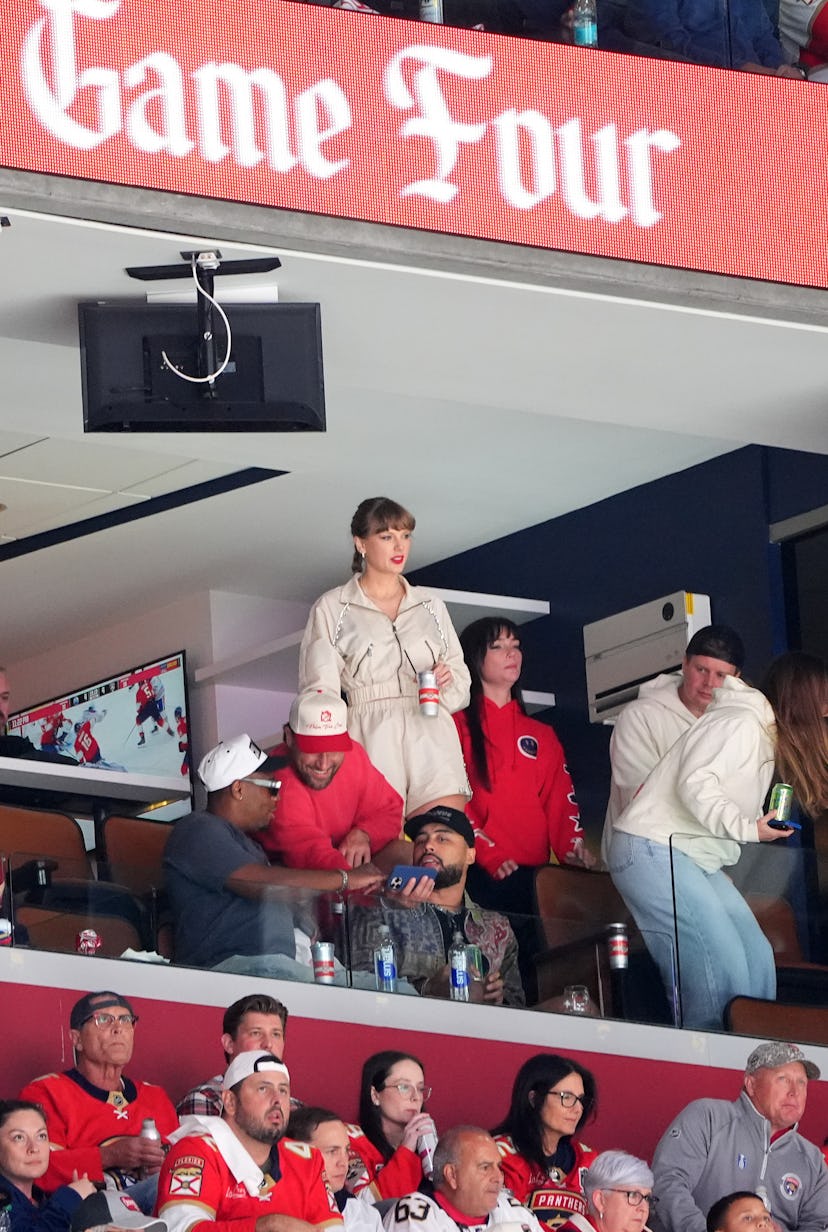 NFL player Travis Kelce and singer Taylor Swift are seen during the overtime period of Game Four of ...