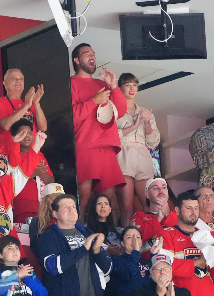 NFL player Travis Kelce and singerTaylor Swift are seen cheering during the first period of Game Fou...