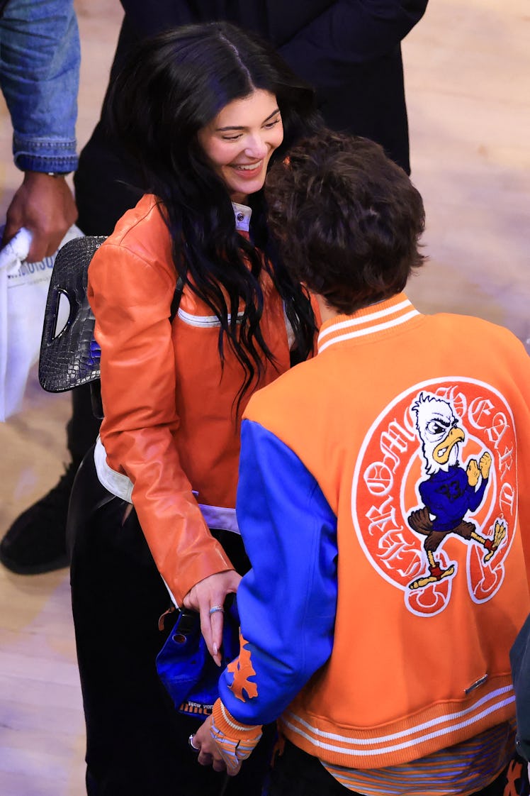 US socialite Kylie Jenner (L) celebrates with her boyfriend US-French actor Timothee Chalamet (R) at...