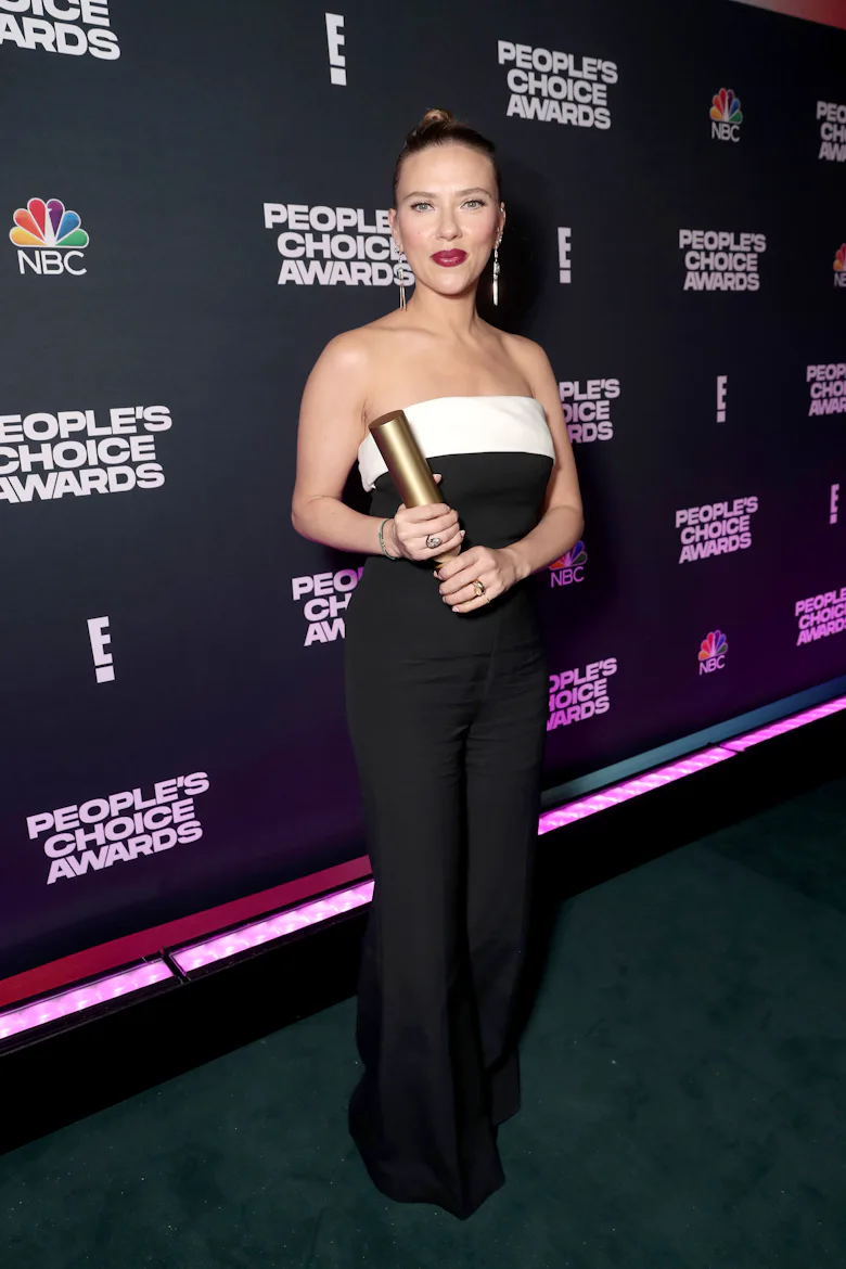 Scarlett Johansson, recipient of The Female Movie Star of 2021 award, poses backstage during the 202...