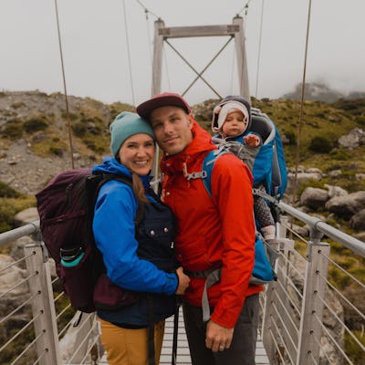 A couple is vacationing with their baby.