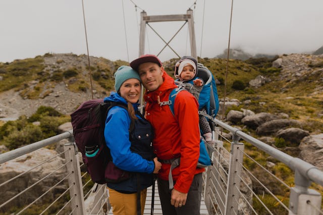 A couple is vacationing with their baby.