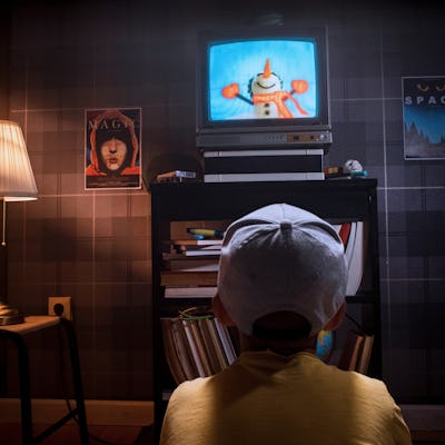 Kid watching cartoons tv show