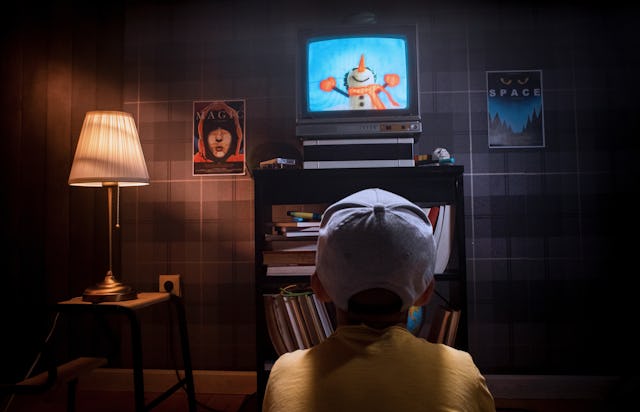 Kid watching cartoons tv show