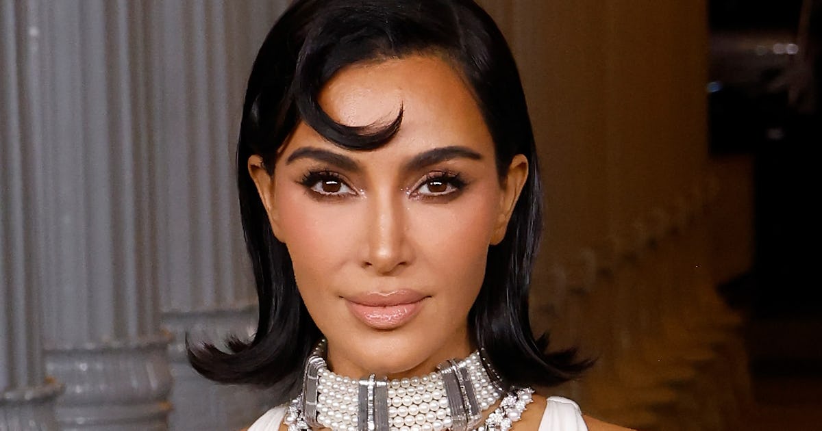 Kim K's Cleavage Was On Full Display In This Plunging Snakeskin Dress