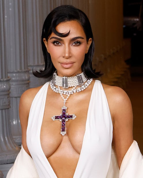 Kim Kardashian wore a snakeskin dress to Jeff Bezos' wedding.