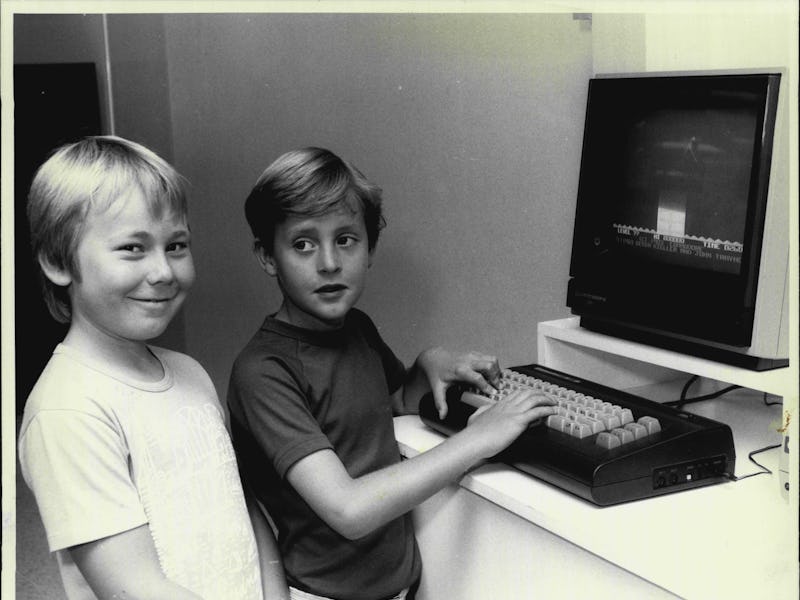 Lyle Bettson Barker and Adam Begg (dark shirt) with a commodore 16K computer. December 6, 1985. (Pho...