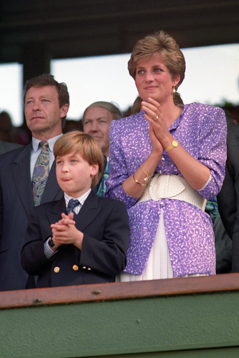 Diana, Princess of Wales and Prince William stand and applaud in the Royal Box on Centre Court at Wi...