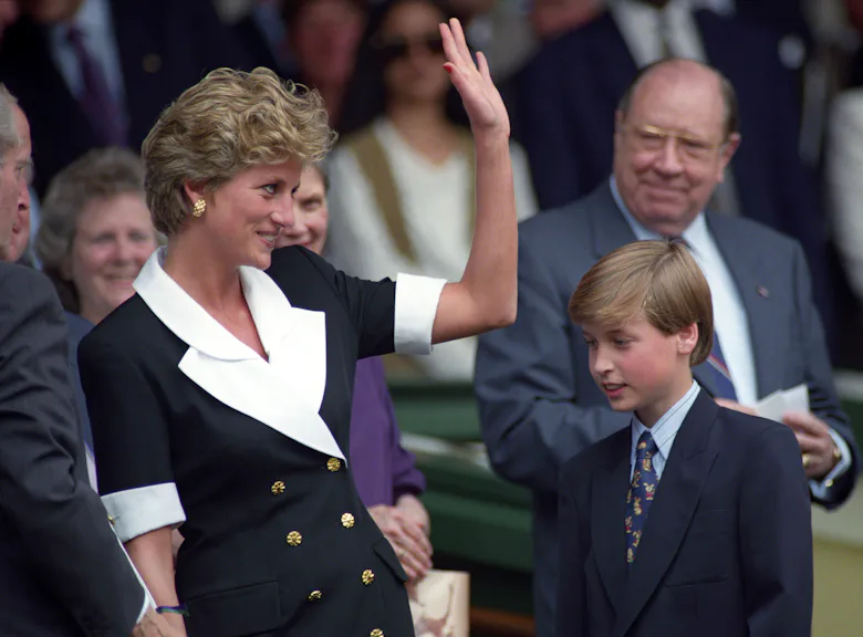 Princess Diana, Princess of Wales (1961 - 1997) and Prince William look on and applaud from the Roya...