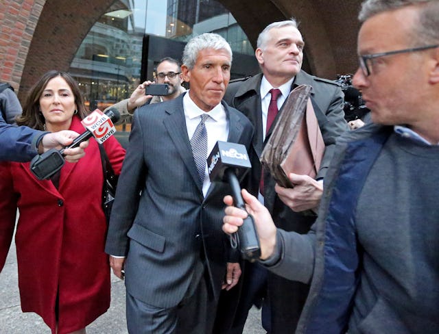 Varsity Blues mastermind William Rick Singer leaves the Moakley Courthouse after being sentenced to...