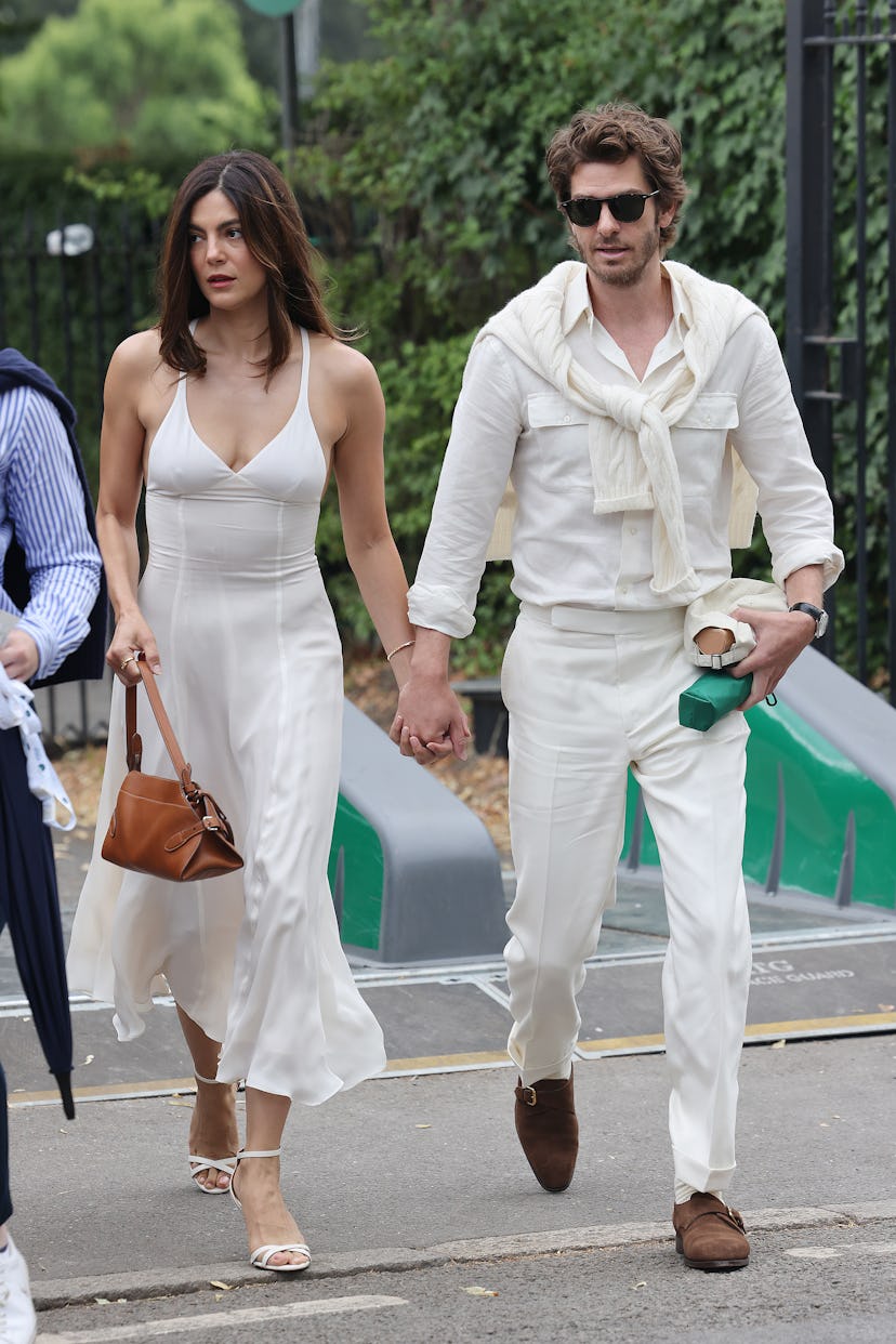 Monica Barbaro and Andrew Garfield arrive at All England Lawn Tennis and Croquet Club on July 06, 20...