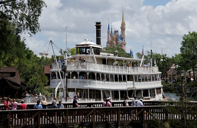 The Liberty Square Riverboat sails in front of Cinderella's Castle at the Magic Kingdom Park at Walt...