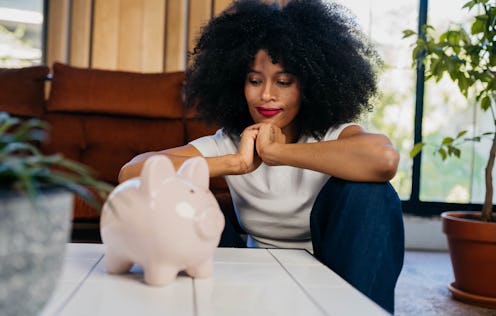 Woman is ready to open her piggy bank
