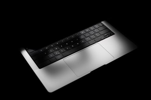 Open Glowing New Modern Laptop Mockup in three-quarters in black Background, Based on a High-quality...