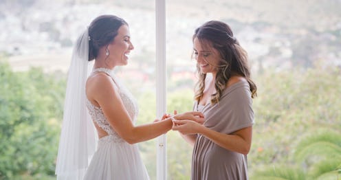 Happy women or bride and bridesmaid smile prepare for a wedding during a conversation. Excited, beau...